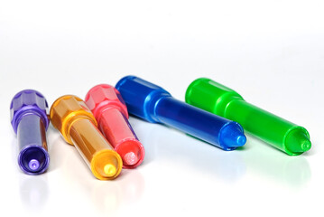 Colorful markers on white background