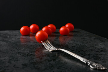 fork and tomatoes on a flat lay