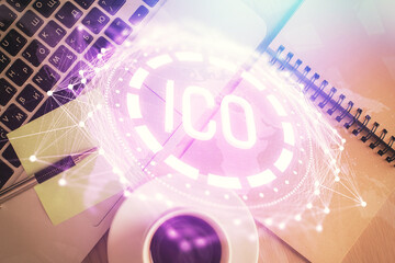 Blockchain theme hologram drawings over computer on the desktop background. Top view. Double exposure.