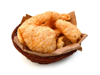 pork rinds in basket on isolated white background