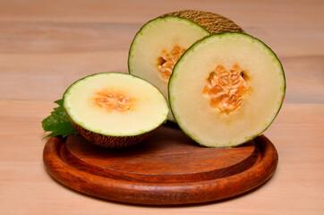 delicious cut melon on a wooden board