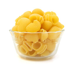 shell pasta in glass bowl, isolated on white background, top view