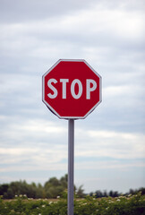 stop sign on cloudy sky background