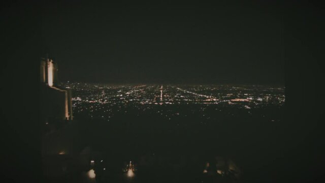 The Griffith Observatory at night time in Los Angeles, California. Vintage Film Look. 