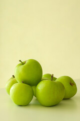 Tasty green apples on light background