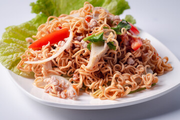 Salad of instant noodles in a white plate