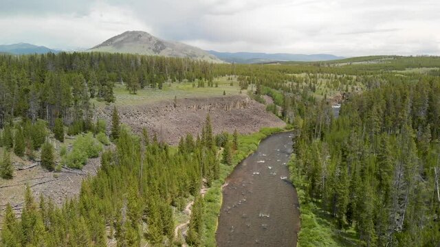 Overflying beautiful Yellowstone river with mountain landscape, Wyoming