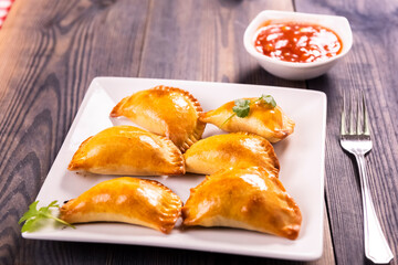 Empanada  -dumplings stuffed with meat and vegetable.