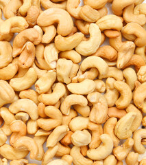 Roasted cashew nuts on background