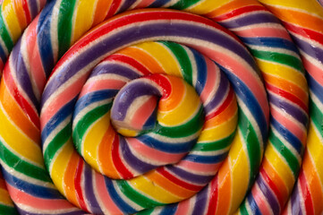 Fototapeta na wymiar Colorful swirl lollipop surface.
