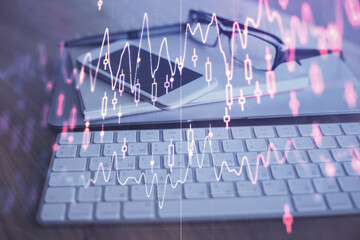 Obraz premium Double exposure of forex chart drawing and cell phone background. Concept of financial trading