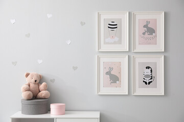 Stylish baby room interior with cute pictures on wall