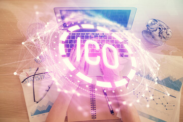 Double exposure of woman hands working on computer and blockchain theme hologram drawing. Top View. bitcoin cryptocurrency concept.