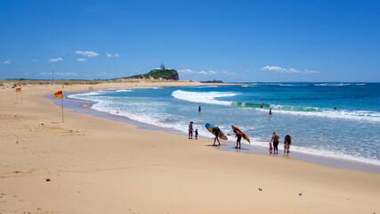 People on the beach at Nobby's beach, Newcastle, NSW, Australia