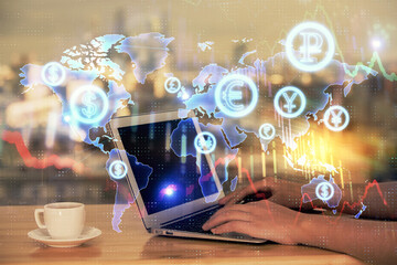 Double exposure of businesswoman hands typing on computer and forex chart hologram drawing. Financial analysis concept.