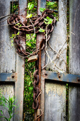 Old key lock locked with a chain.   