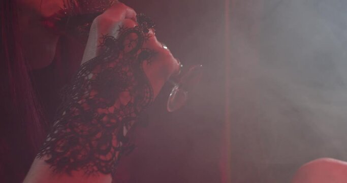 Succubus is drinking blood in a smoke filled room, smiling, 4k