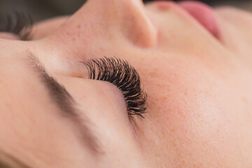 Right eye with eyelash extensions.  Concept of health and beauty.