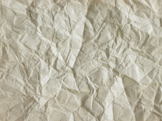 wrinkled sheet of old paper close, soft focus
