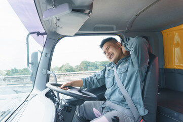 Professional adult truck driver is tired, transport, and deliver for a long time.