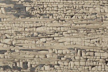 old rough boards covered with cracked gold paint, lowered color