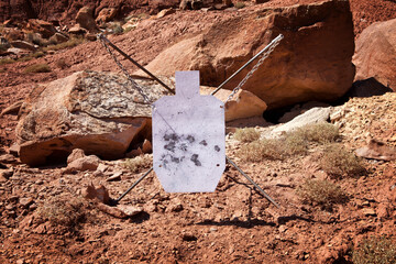 Steel target for practice shooting in the mountains.