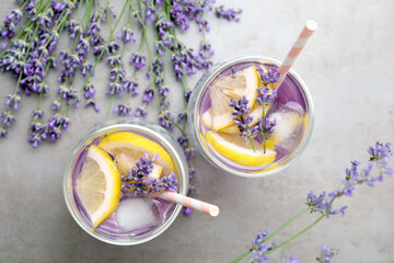 Fresh delicious lemonade with lavender on grey table, flat lay