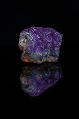 Sugilite violet Kalahari stone on black background