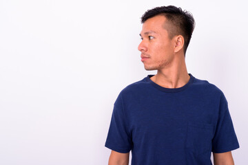 Portrait of young Asian man with beard stubble