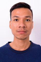 Obraz premium Portrait of young Asian man with beard stubble