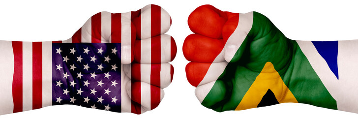 Fototapeta na wymiar Two hands are clenched into fists and are located opposite each other. Hands painted in the colors of the flags of the countries. South Africa vs USA
