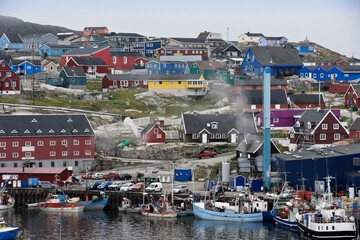 Colorful buildings overlook the fishing harbor in Ilulissat, West Greenland © Michele Burgess