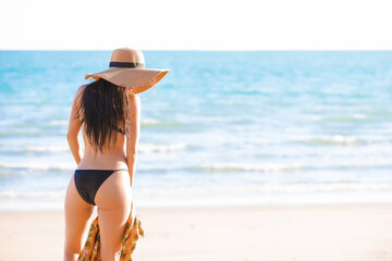 Beautiful sexy asian women in a sexy bikini on tropical beach	