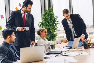 Group of professional business meeting and discussing strategy with new startup project.Creative business people planning and brainstorm with laptop computer in modern office.Teamwork concept