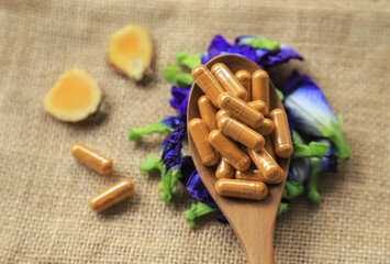 Yellow herbal capsules for healthy eating in home 