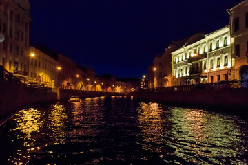 Fototapeta na wymiar Night view of the Moyka river in St. Petersburg, Russia