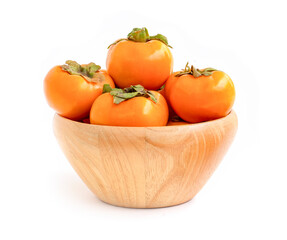 Persimmon in a bowl on white.