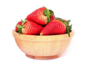 strawberries in a bowl isolated on white.