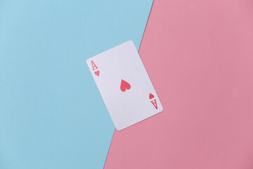 Ace of hearts on pink blue background. Top view. Flat lay