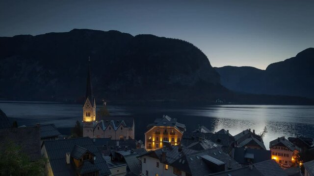 Beautiful Village Hallstatt in Austria, Sunrise over the Top, Water Flows, moving Timelapse
