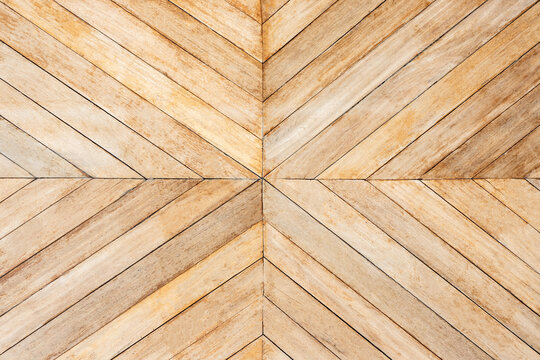 seamless brown color lumber in arrows or chevron pattern to the center. top view