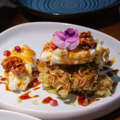 Fried banana fritters with cream