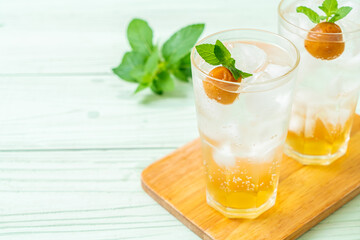 iced plum juice with soda and peppermint