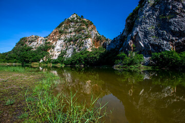 Close-up natural background of atmosphere surrounded by large rocky mountains, natural reservoirs and various trees, the integrity of the ecology