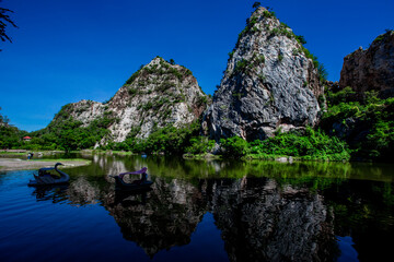 Close-up natural background of atmosphere surrounded by large rocky mountains, natural reservoirs and various trees, the integrity of the ecology