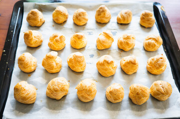A tray of golden cream puff with no whipping cream