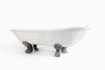 white vintage ceramic bathtub handmade on light background