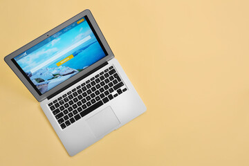 Modern laptop on color background. Concept of online booking