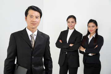 Young Asian male female wearing business office suit stand look at camera cross hand