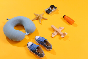 Travel accessories for children on color background